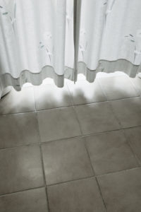 Curtain almost touching the stone floor Curtain almost touching the stone floor